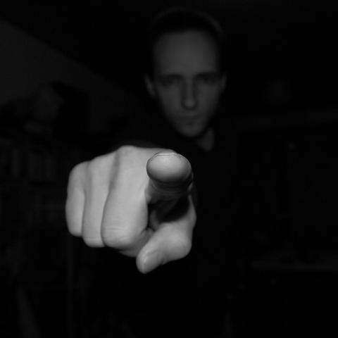 An image of a person pointing a finger