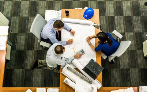 Three people in a meeting